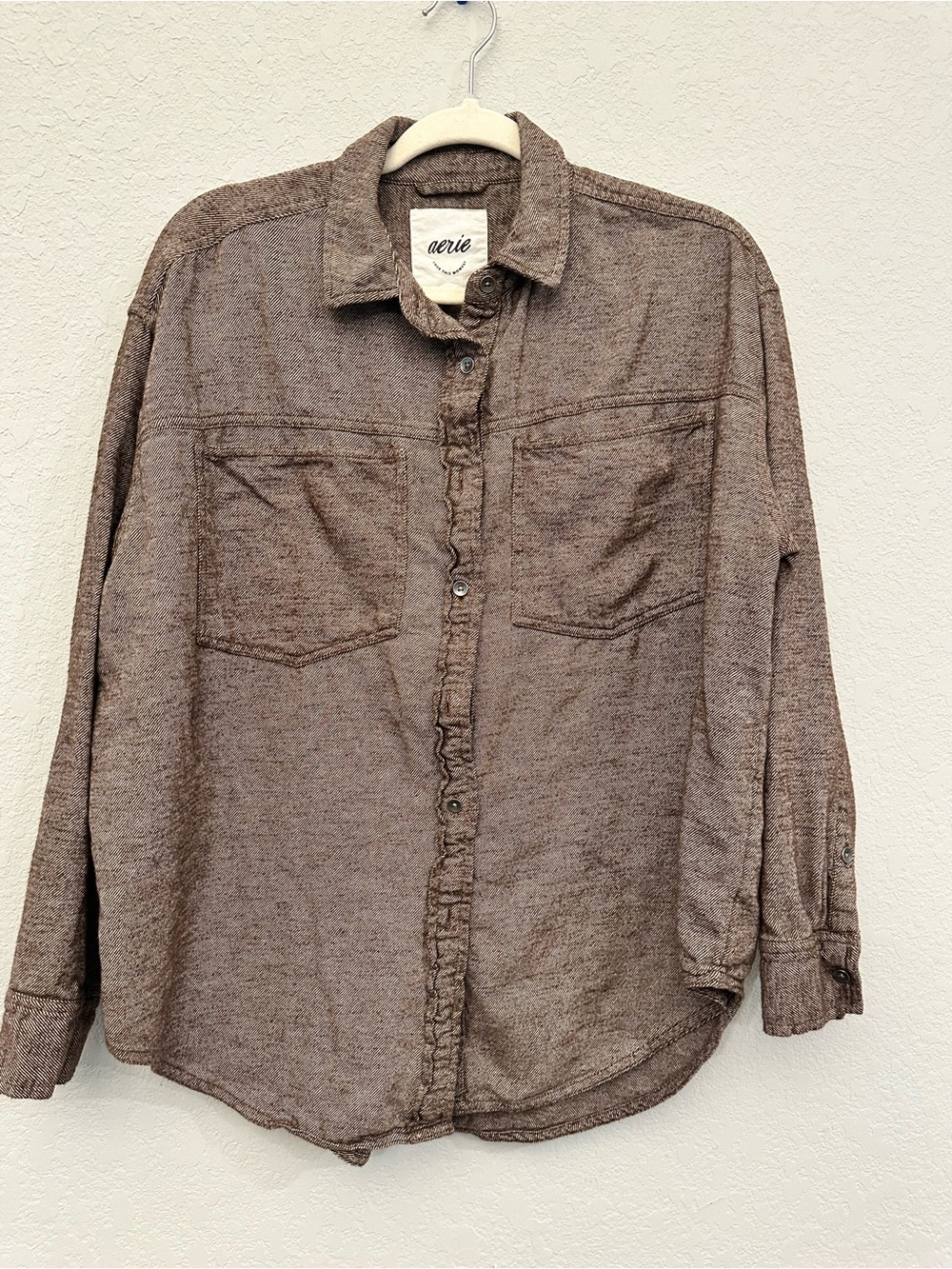 Aerie brown striped button-up shirt with dual chest pockets.